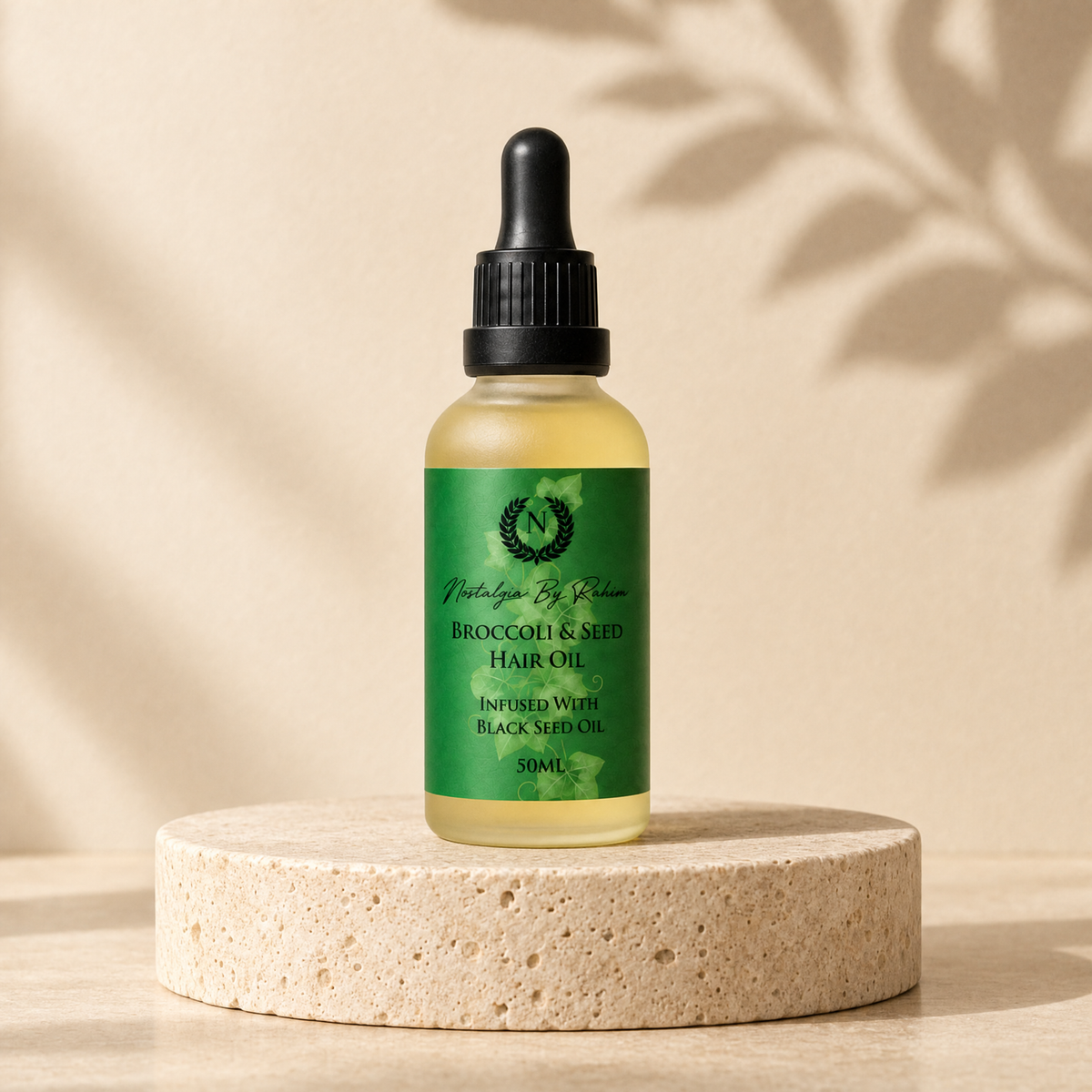 Broccoli & Seed Hair Oil bottle on a stone plinth